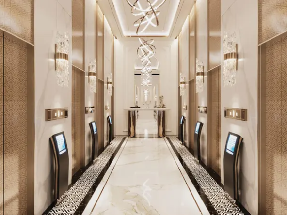 Grand lobby entrance, featuring marble flooring, elegant lighting, and gold accents.